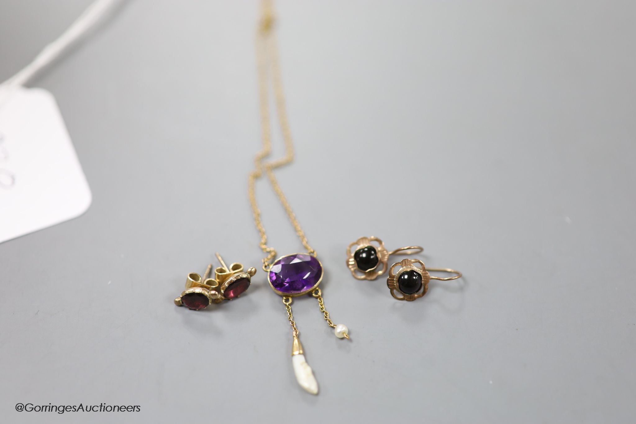 A 15ct amethyst and baroque pearl drop pendant (stone missing) and two pairs of yellow metal and gem set earrings